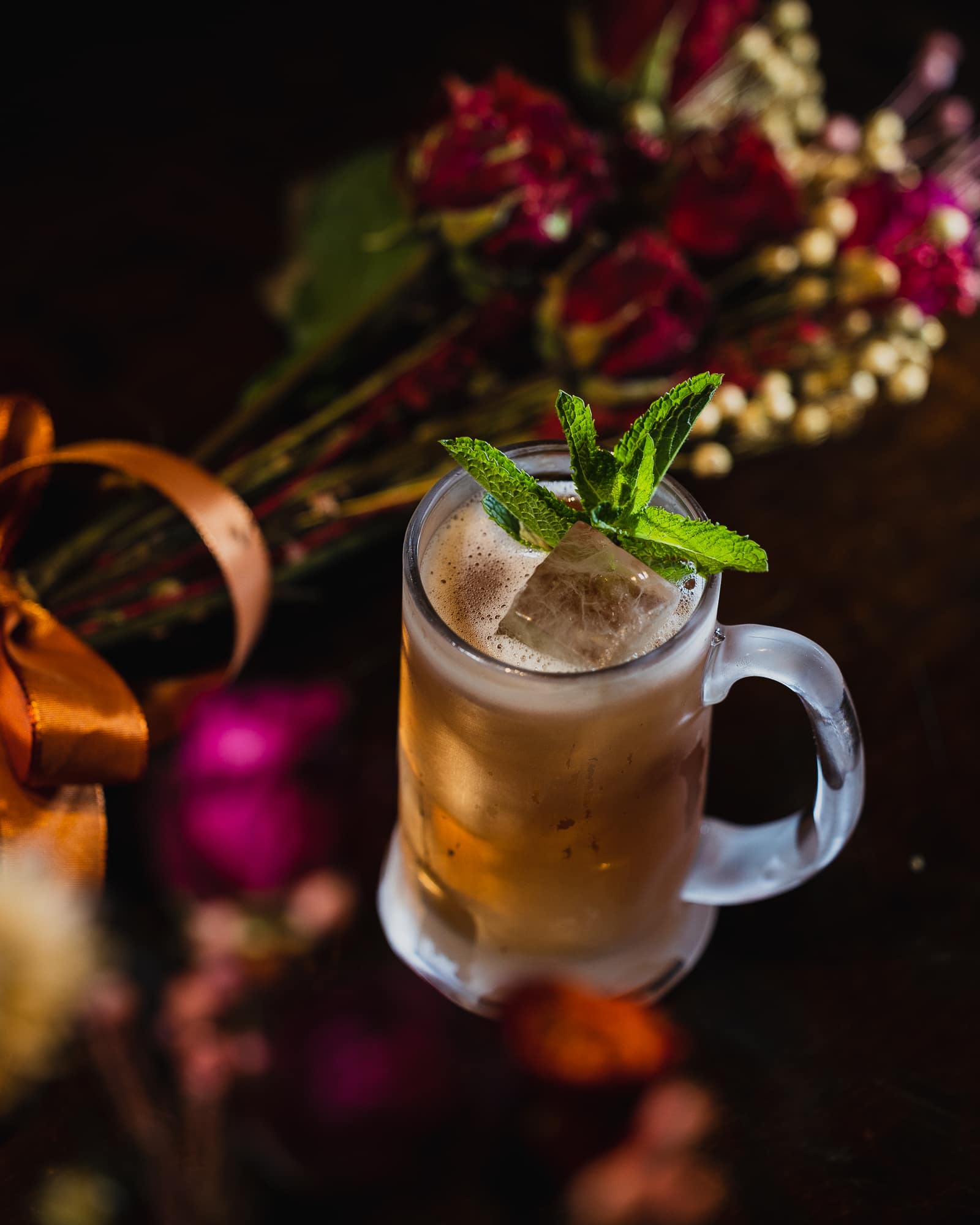 Cocktails beside flowers at Bingo Drinkery