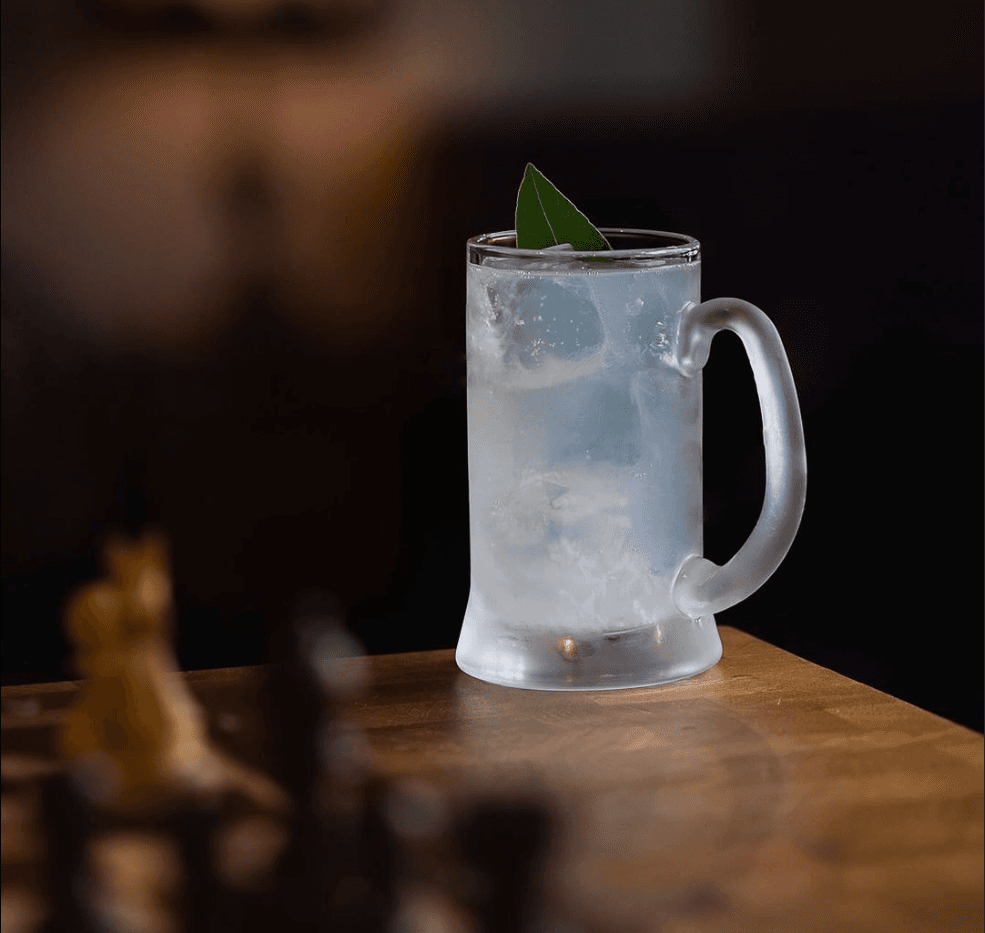 A frosted blue cocktail in a mug