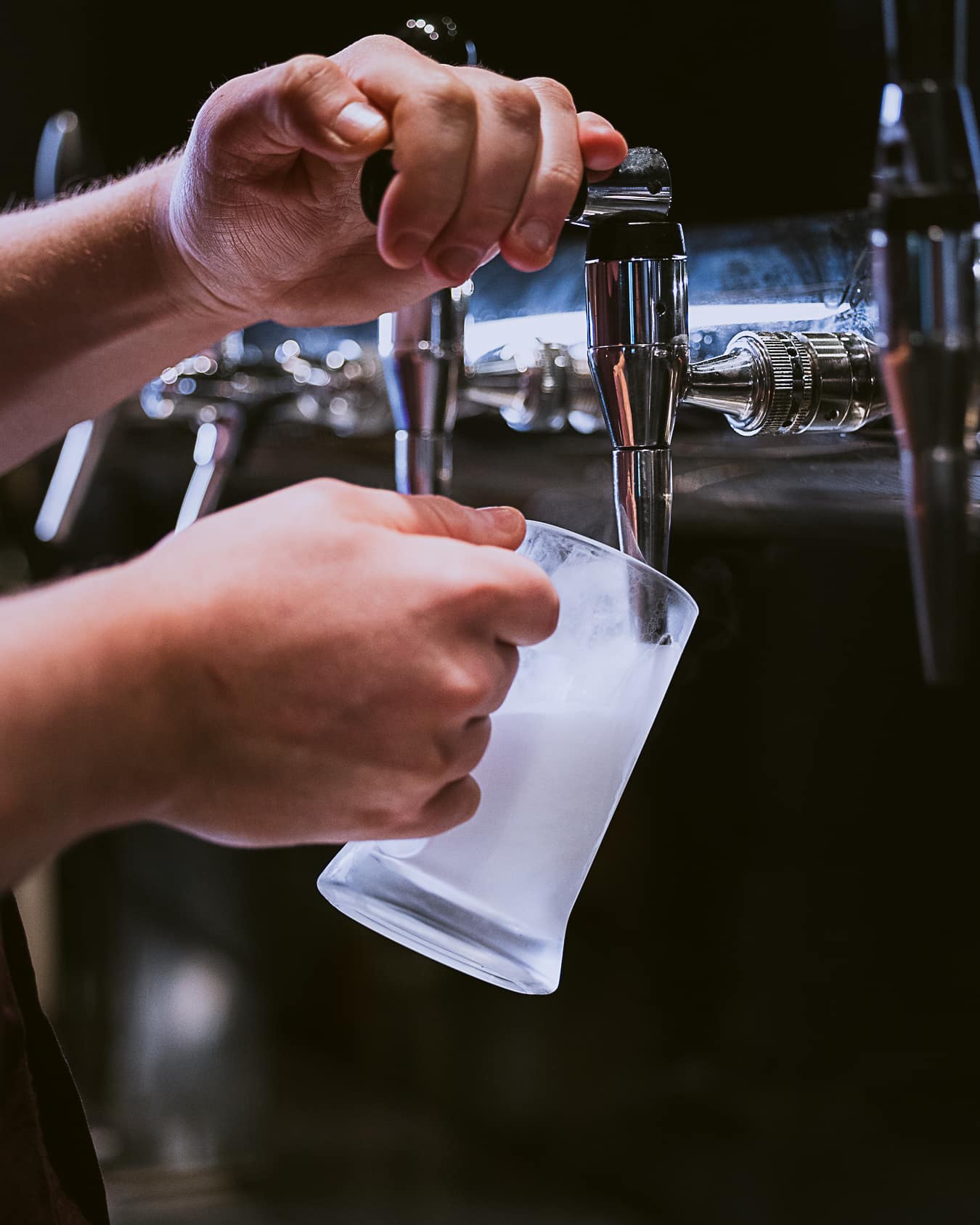 A bartender pouring a drink at Bingo Drinkery